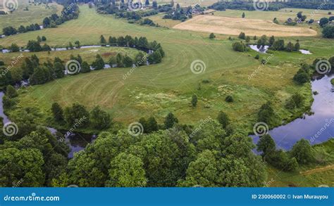 Aerial Landscape Of Winding River In Green Field Top View Of Beautiful