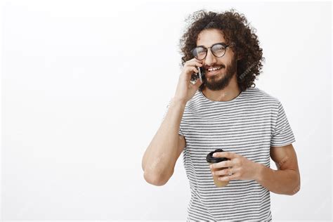 Free Photo Portrait Of Carefree Good Looking Bearded Guy In Glasses