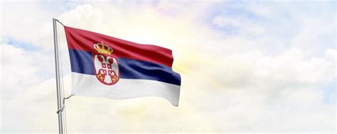 Premium Photo Serbia Flag Waving On Sky Background D Rendering