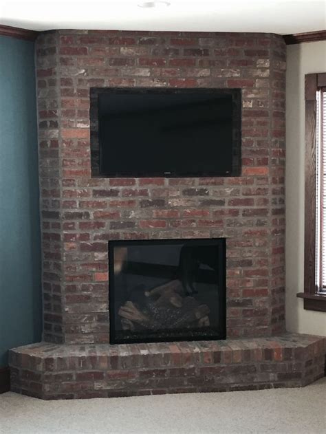 corner brick fireplace | Corner brick fireplaces, Fireplace mirror ...