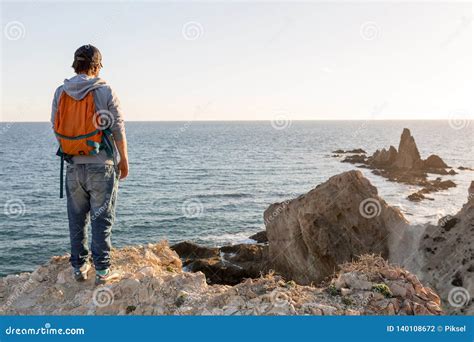 Man Exploring Spanish Coastline Stock Photo Image Of Cabo Hills