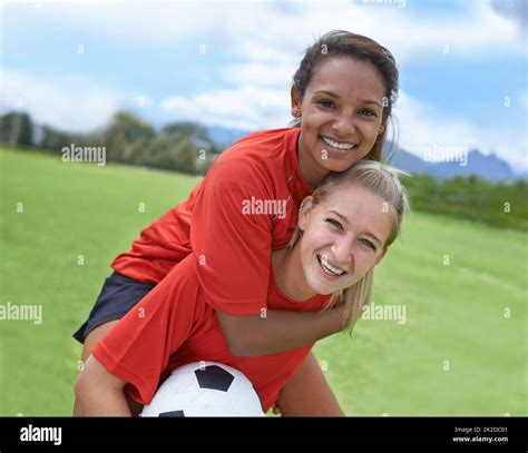 Best Friends And Teammates Shot Of A Female Soccer Player Carrying Her