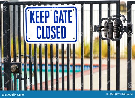 Keep Gate Latched Sign On Metal Fence Stock Photo Cartoondealer