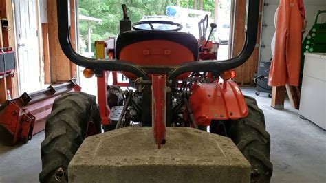 How To Remove The Loader Bucket From A Kubota B7100 Tractor With A