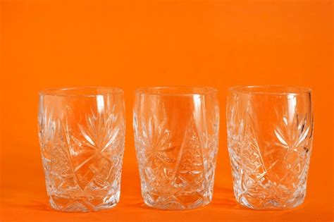 Premium Photo Shot Glasses On Orange