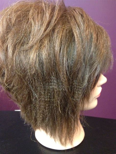 Textured Flat Iron Style And Stacked Diagonal Forward Haircut Shaggy