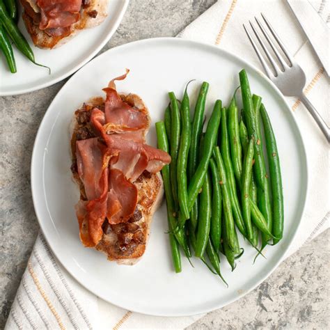 Pork Chop With Cinnamon Date Topping Prosciutto Garlic Green Beans