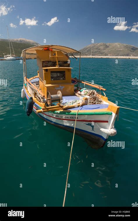 A Greek Fishing Boat Is Moored In Sami Harbour Stock Photo Alamy