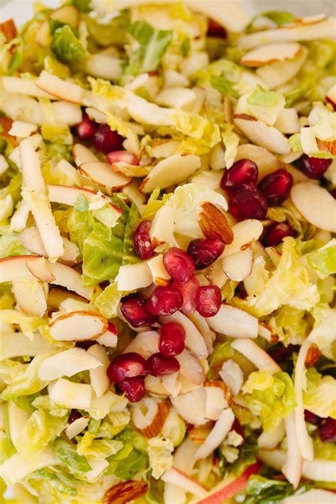 Shredded Brussels Sprouts And Spiralized Apple Slaw With Maple Cider Dressing And Pomegranates