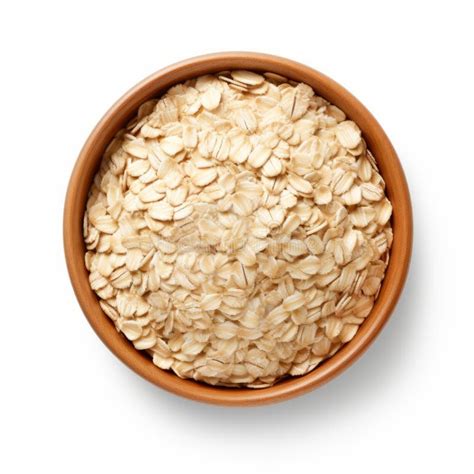 Close Up Of Rolled Oats In A Bowl On White Background Stock