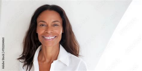 Professional Portrait Of Woman In 40s With Natural Hair With Smiling