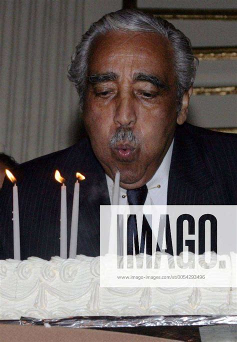 Congressman Charles Rangel D Ny Blows Out Candles On A Cake During