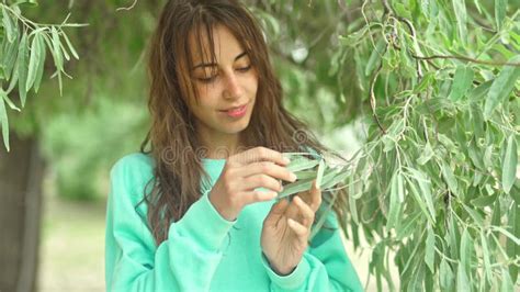 Candid Portrait Of Attractive Brunette Woman Smiling To Camera And Looking Happy Standing At