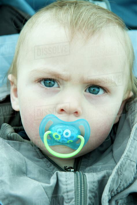 Baby With Pacifier In Mouth Portrait Stock Photo Dissolve