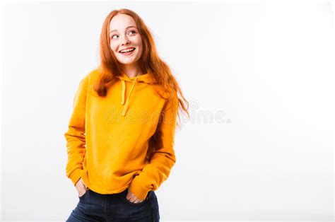 Portrait Of An Emotional Red Haired Girl With Freckles And Braces On A