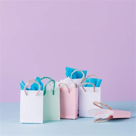 Free Photo | Many multicolored shopping paper bags in front of pink ...