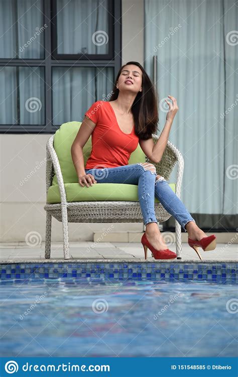 Contemplative Adult Colombian Business Woman Wearing Suit Stock Photo