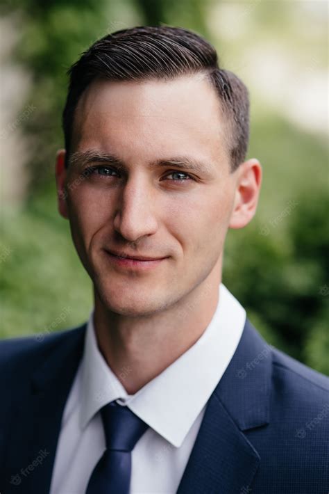 Premium Photo Portrait Of A Beautiful Business Man In A Blue Suit