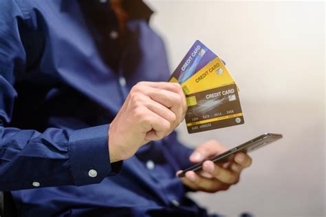 Premium Photo Midsection Of Person Holding Mobile Phone