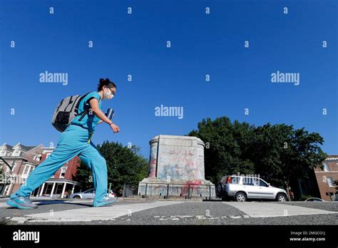 Eds Note Obscenity A Passerby Walks Past The Pedestal Where The Statue Of Confederate General