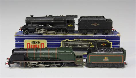 A small collection of Hornby Dublo three-rail locomotives and tenders ...