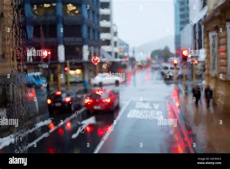 Cars At Traffic Lights On City Street In Heavy Rain Wellington North