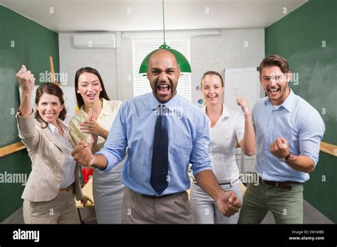 Excited Business Team Cheering At Camera Stock Photo Alamy