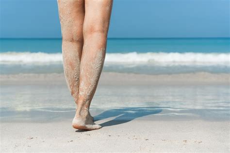 Premium Photo Low Section Of Person On Beach