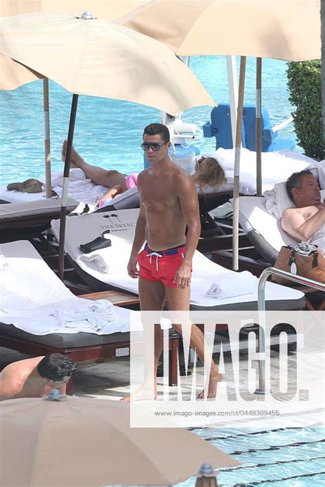 Soccer Stud Cristiano Ronaldo Shows Off His Deep Tan And Rock Hard Abs