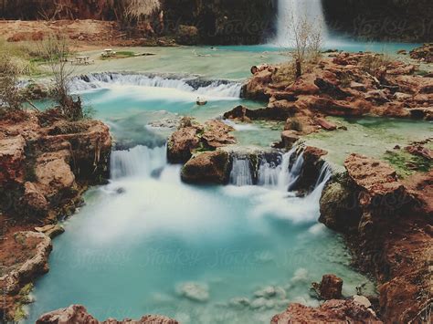 "Blue Waterfall Pool" by Stocksy Contributor "Kevin Russ" - Stocksy