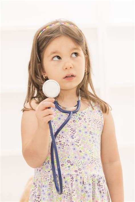 Little Girl Playing Doctor With Stethoscope Stock Photo Image Of