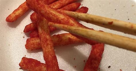 Using Chopsticks To Avoid Red Fingers Cause By Hot Cheeto Fries