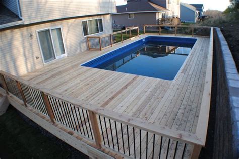 Rectangle Pool Deck Ideas / Stand two 4×4 posts in the square sockets ...