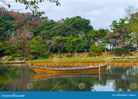 Sankeien Garden With Trees Boat And Water In Yokohama Autumn