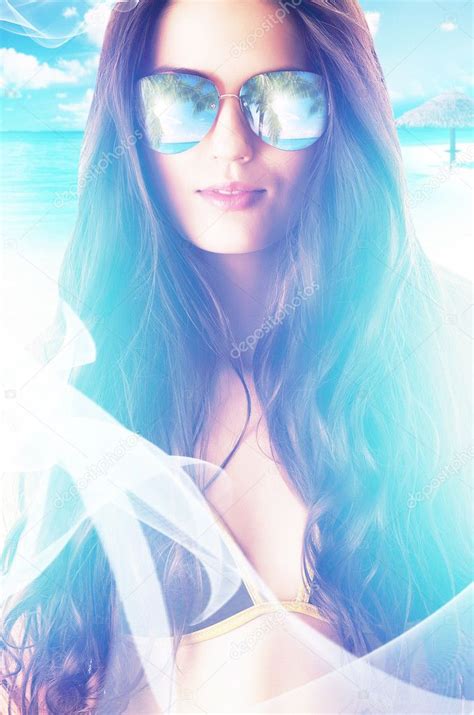 Close Up Portrait Of Woman In Sunglasses On The Beach Stock Photo