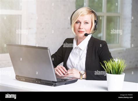 Beautiful Blonde Adult Woman Call Center Operator Dressed In Black