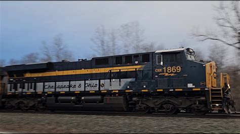 CSX M634 With ES44AH 1869 Chesapeake Ohio Heritage Locomotive Leading