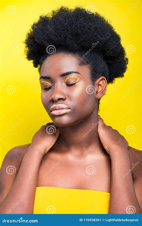 African American Woman With Closed Eyes Isolated On Yellow Stock Image