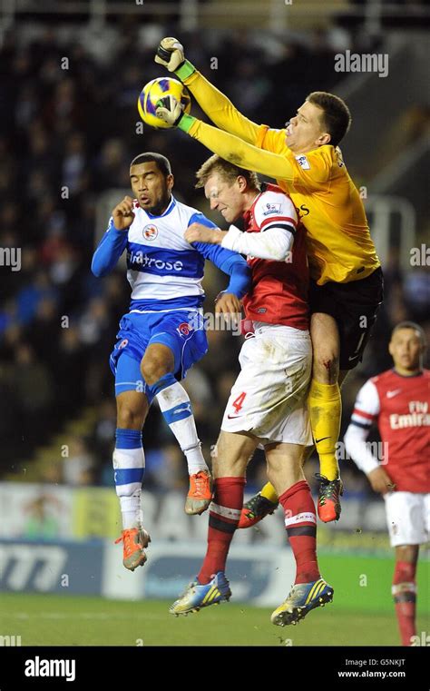 Arsenal S Goalkeeper Wojciech Szczesny Attempts To Punch Clear Under