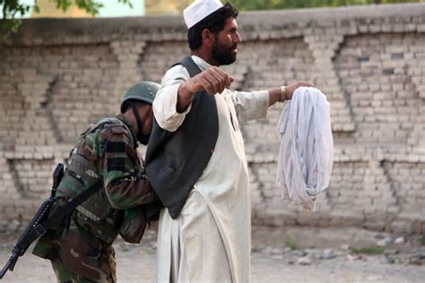 An Afghan National Army Soldier Searches A Man Before Nara And Dvids