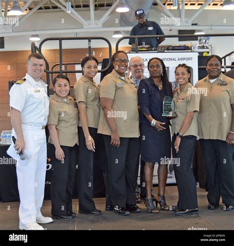 Naval Station Norfolk Tour And Information Office Pose For A Group