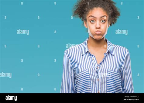 Young Afro American Woman Over Isolated Background Puffing Cheeks With Funny Face Mouth