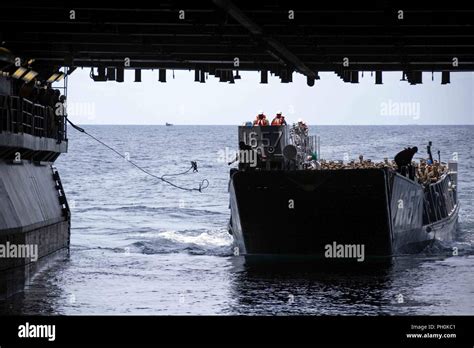 ATLANTIC OCEAN June 16 2018 Sailors Throw A Line Toward A Landing