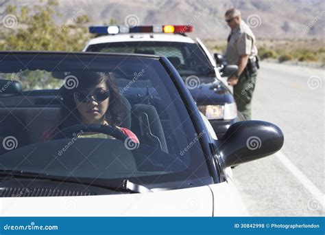 Police Officer Pulling Someone Over