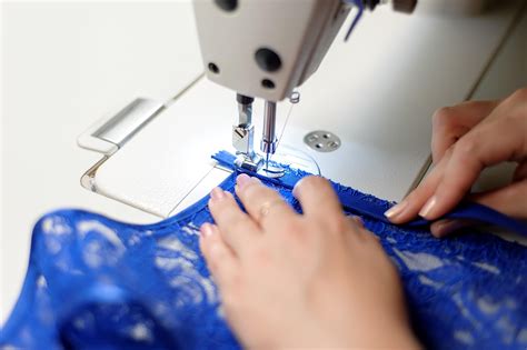 Person Sewing Blue Fabric 1946989 Stock Photo At Vecteezy