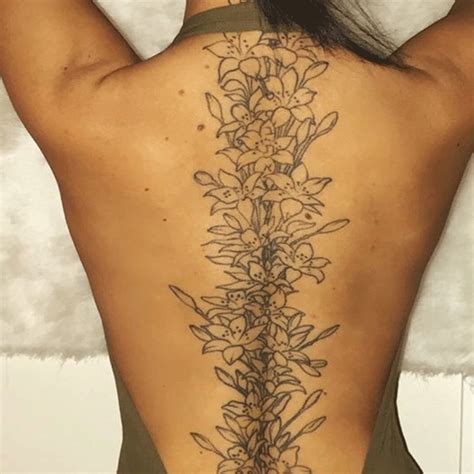 A Vine Of Gorgeous Florals Down Your Spine Is As Delicate As It Is