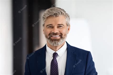 Premium Photo Portrait Of Handsome Smiling Middle Aged Businessman