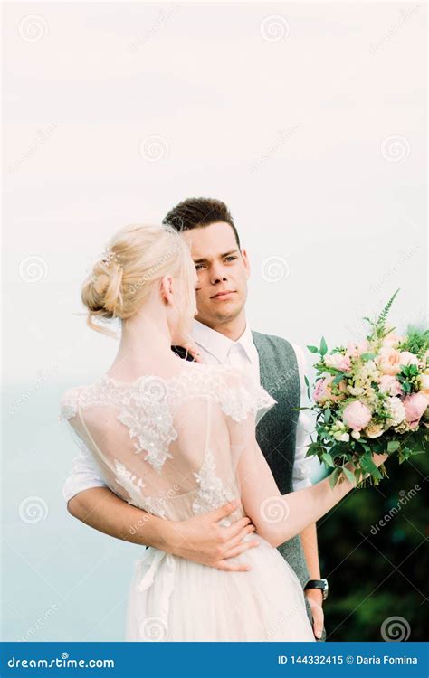 Beautiful Portrait Of Bride And Groom Hug Each Other Tender Stock Image