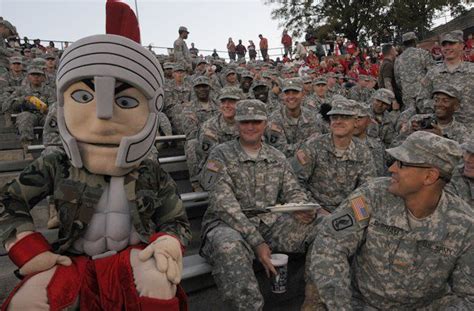 T-Roy, the mascot of the Troy Trojans, interacts with Soldiers from the Warrant Officer Career ...