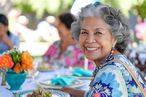 Premium Photo A Woman Sitting At A Table With Plates Of Food